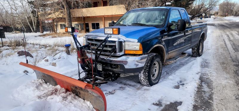 Commercial snow removal plow truck in Crestone, Colorado