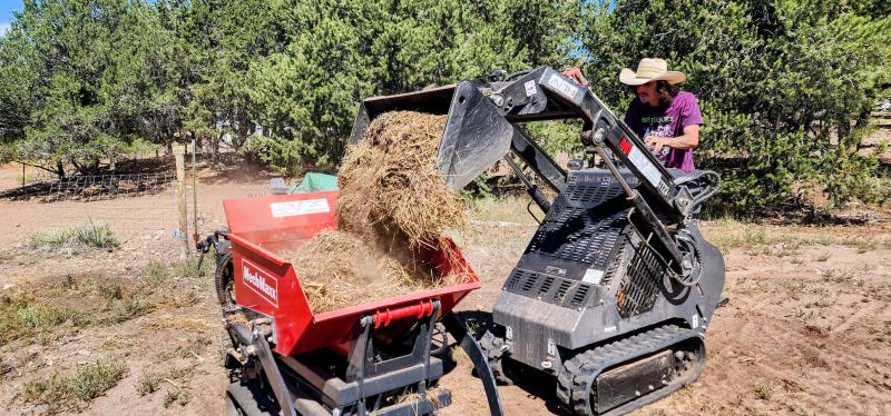 Equipment operator and mini dumper on a Crestone property