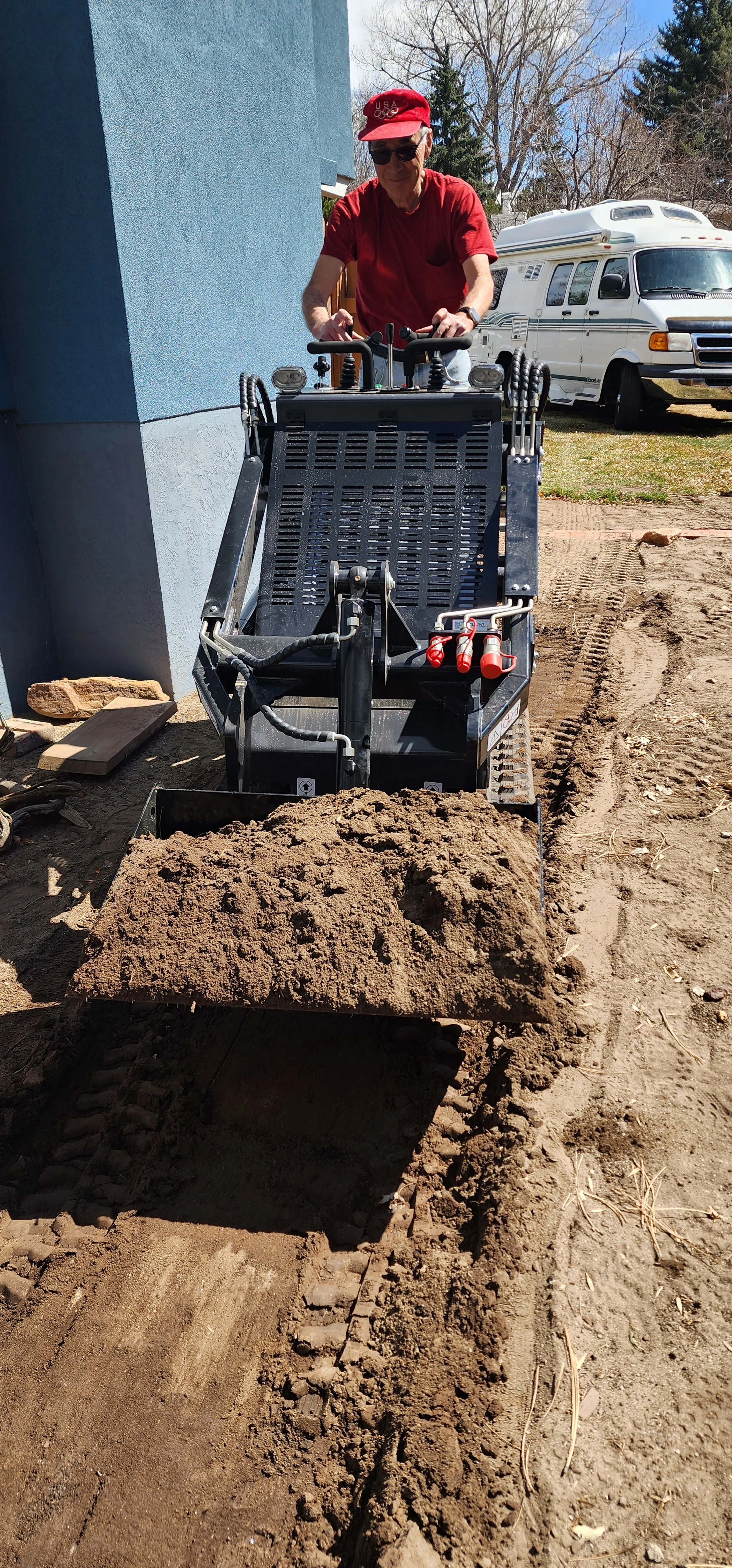 Light excavation with mini skid steer in Crestone, Colorado